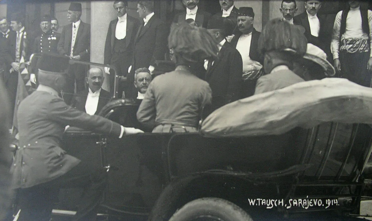 The open car outside Sarajevo city hall on 28 June 1914, officials and dignitaries standing around it.