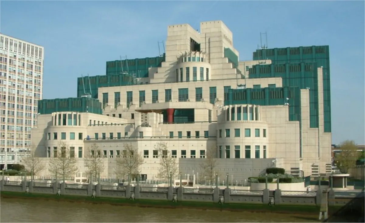 The Secret Intelligence Service building at Vauxhall Cross, London, a stepped cream and green structure on the bank of the Thames.