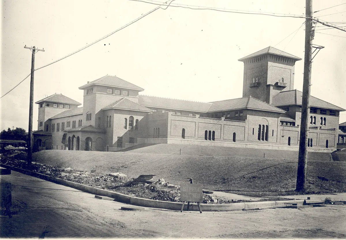The Monroe Avenue Water Filtration Plant in Grand Rapids, Michigan, photographed in 1930: a low brick municipal building with tiled roofs and towers.