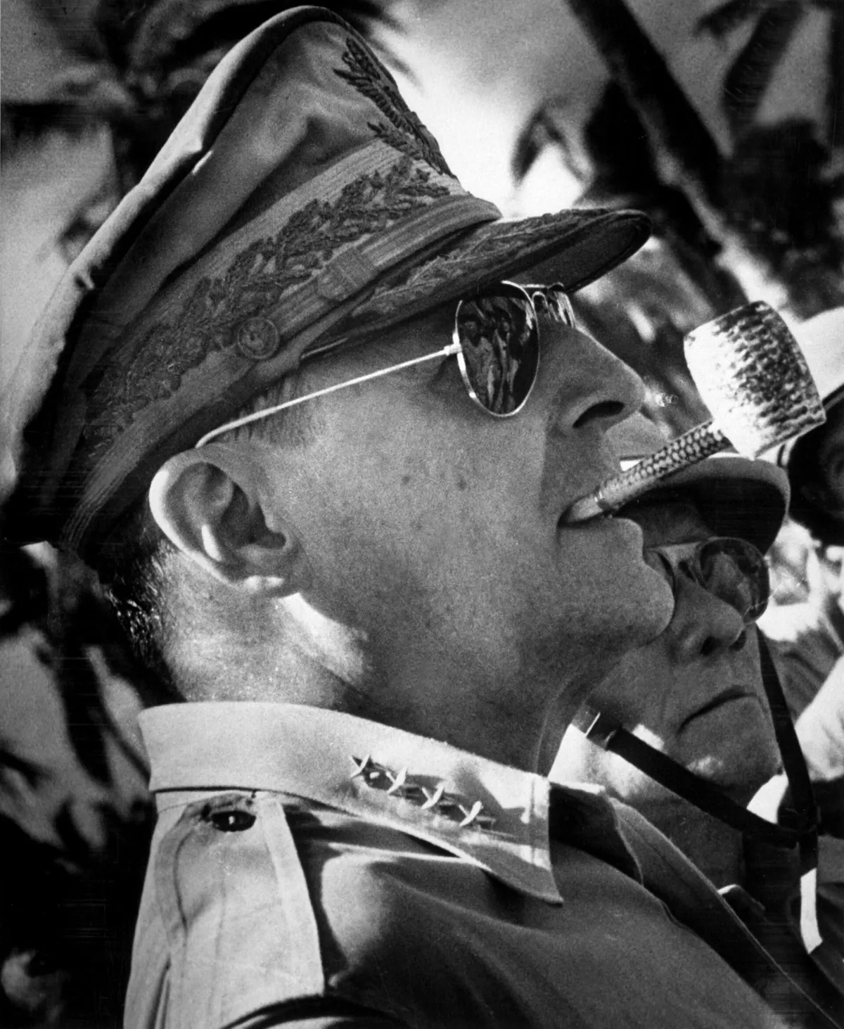 General Douglas MacArthur surveys the beachhead on Leyte Island, soon after American forces swept ashore from a gigantic liberation armada into the central Philippines, at the historic moment when the General made good his promise "I shall return" 1944. 26-G- 3584