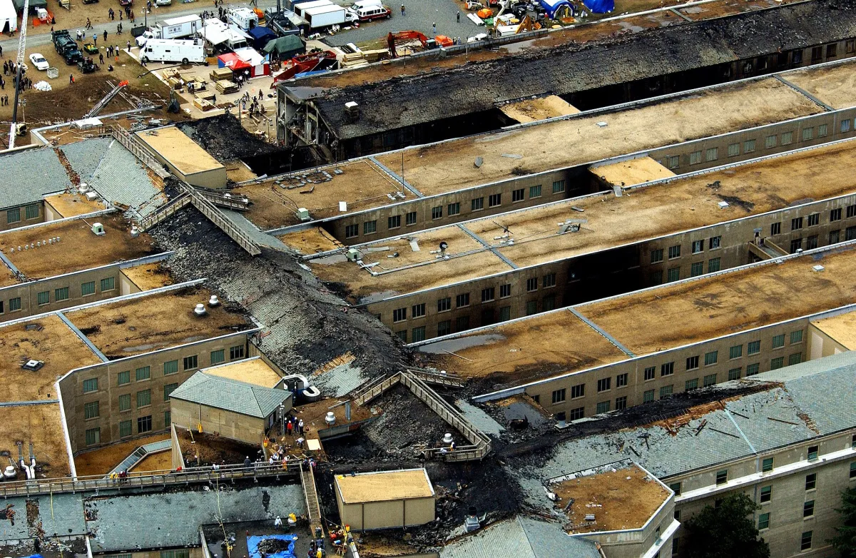010914-F-8006R-004 Arlington, Va. (Sep. 14, 2001) -- This aerial photograph of the Pentagon taken on Sep. 14, 2001, shows some of the destruction caused when the hijacked American Airlines flight slammed into the building on Sep. 11. The terrorist attack caused extensive damage to the west face of t