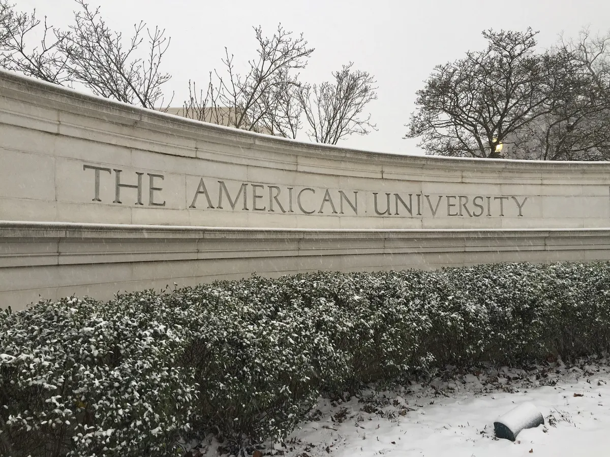A stone and ironwork gateway at the entrance to the American University campus in Washington, D.C.