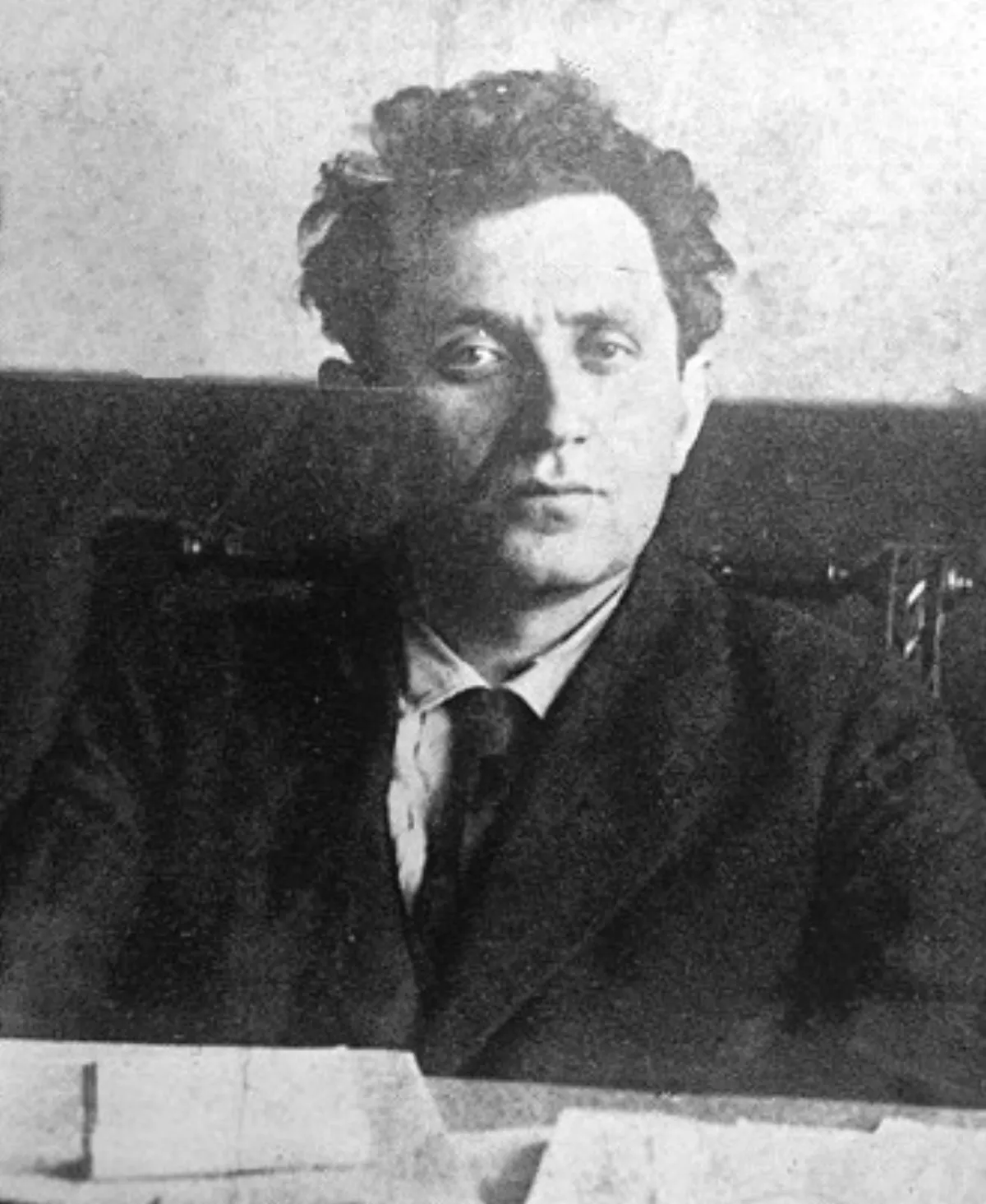 Grigory Zinoviev, seated at a desk, in a photograph from the early Soviet period.